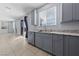 Bright kitchen featuring gray cabinets, granite countertops and stainless steel appliances at 10373 Northern Hills Ave, Las Vegas, NV 89166