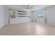Large living room with tiled flooring, ceiling fan, and plenty of natural light at 10373 Northern Hills Ave, Las Vegas, NV 89166