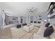 Bright, open concept living room with tile flooring, ceiling fan, and easy access to kitchen at 10373 Northern Hills Ave, Las Vegas, NV 89166