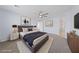 Serene main bedroom with neutral tones, plush carpet, ceiling fan, and ensuite bathroom access at 10373 Northern Hills Ave, Las Vegas, NV 89166