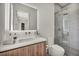 Modern bathroom with an LED mirror, sleek vanity, and glass-enclosed shower at 10528 Garden Light Dr, Las Vegas, NV 89135