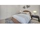 Bright bedroom features a round bed, a modern lamp on each side, and white double closets at 10528 Garden Light Dr, Las Vegas, NV 89135