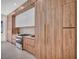 Modern kitchen with wood-grain cabinets, stainless steel appliances, and sleek countertops at 10528 Garden Light Dr, Las Vegas, NV 89135