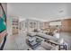 Contemporary living area flows into kitchen, featuring sleek finishes and abundant natural light at 10528 Garden Light Dr, Las Vegas, NV 89135