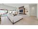 Bright living room featuring modern fireplace, built-in shelving, and access to the backyard pool at 10528 Garden Light Dr, Las Vegas, NV 89135