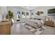 Bright and airy main bedroom features a plush bed, access to backyard and a stylish accent wall at 10528 Garden Light Dr, Las Vegas, NV 89135