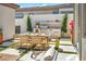 Outdoor dining area featuring a full dining set and outdoor kitchen perfect for outdoor entertaining at 10528 Garden Light Dr, Las Vegas, NV 89135