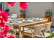 Cozy outdoor dining area offering an inviting space for gatherings with a beautifully decorated table at 10528 Garden Light Dr, Las Vegas, NV 89135