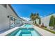 Resort-style backyard featuring a sparkling pool, spa, and lounge area, perfect for outdoor relaxation at 10528 Garden Light Dr, Las Vegas, NV 89135