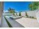 Spacious backyard featuring a pool and spa combination with tasteful landscaping and ample lounging space at 10528 Garden Light Dr, Las Vegas, NV 89135