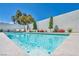 Stunning pool showcasing crystal-clear water and a serene backyard setting, ideal for hot summer days at 10528 Garden Light Dr, Las Vegas, NV 89135