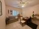 Bedroom boasts natural light, tile floors, a ceiling fan, and furniture at 10561 Rancho Destino Rd, Las Vegas, NV 89183