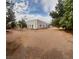 Large, detached shop building with multiple garage doors, and surrounding gravel landscaping at 10561 Rancho Destino Rd, Las Vegas, NV 89183