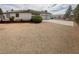 Single-story house with a detached garage, concrete driveway, and desert landscaping at 10561 Rancho Destino Rd, Las Vegas, NV 89183