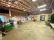 Expansive garage with unfinished ceiling and ample storage at 10561 Rancho Destino Rd, Las Vegas, NV 89183