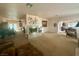 Inviting living room featuring a fireplace and views into the dining area at 10561 Rancho Destino Rd, Las Vegas, NV 89183