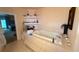 This main bathroom offers a jacuzzi tub with tile surround, shelves, and views into the main bedroom at 10561 Rancho Destino Rd, Las Vegas, NV 89183