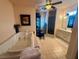 A jacuzzi tub is the main feature of this bathroom which has a separate shower, cabinets and privacy window at 10561 Rancho Destino Rd, Las Vegas, NV 89183