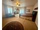 Spacious main bedroom with a ceiling fan and view into ensuite bathroom at 10561 Rancho Destino Rd, Las Vegas, NV 89183
