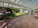 Enjoy outdoor living under this covered patio, offering seating and views of the grassy lawn at 10561 Rancho Destino Rd, Las Vegas, NV 89183