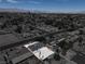 Single-story home boasts a large, gravel-filled backyard enclosed by a wooden fence at 1109 E Tonopah Ave, North Las Vegas, NV 89030