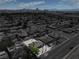Expansive aerial view of a single story home and a large backyard filled with neutral toned gravel at 1109 E Tonopah Ave, North Las Vegas, NV 89030