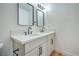 Modern bathroom features dual sinks, stylish fixtures, and sleek vanity with framed mirrors at 1109 E Tonopah Ave, North Las Vegas, NV 89030