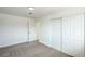 Comfortable bedroom showcasing closet and doorway with neutral colored carpet at 1109 E Tonopah Ave, North Las Vegas, NV 89030