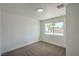 Well-lit bedroom features large window for light and comfortable neutral carpet at 1109 E Tonopah Ave, North Las Vegas, NV 89030