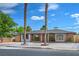 Charming single-story brick home featuring mature trees and a well-maintained front yard at 1109 E Tonopah Ave, North Las Vegas, NV 89030