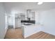 Modern kitchen featuring stainless steel appliances, sleek cabinets, and an island with a cooktop at 1109 E Tonopah Ave, North Las Vegas, NV 89030