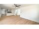 Open-concept living area featuring new flooring and fresh paint, leading to a modern kitchen at 1109 E Tonopah Ave, North Las Vegas, NV 89030