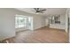 Inviting living room with large bay window and open layout, seamlessly flowing into the updated kitchen at 1109 E Tonopah Ave, North Las Vegas, NV 89030