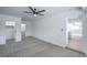 Spacious main bedroom with new carpeting and access to a walk-in closet and en-suite bathroom at 1109 E Tonopah Ave, North Las Vegas, NV 89030