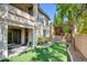 The backyard features a small patch of synthetic grass at 11833 Amistoso Ln, Las Vegas, NV 89138