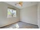 The bedroom features a window and neutral-colored walls and carpet at 11833 Amistoso Ln, Las Vegas, NV 89138