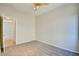 This bedroom has carpet, neutral walls, and a ceiling fan for comfort at 11833 Amistoso Ln, Las Vegas, NV 89138