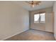 Neutral bedroom with carpet, window, and door to hallway at 11833 Amistoso Ln, Las Vegas, NV 89138