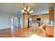 Open floor plan featuring kitchen with light wood cabinets, an island, and stainless steel appliances at 11833 Amistoso Ln, Las Vegas, NV 89138