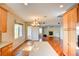 Open floor plan featuring kitchen with light wood cabinets, an island, and stainless steel appliances at 11833 Amistoso Ln, Las Vegas, NV 89138