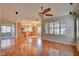 Spacious living room featuring hardwood floors, a cozy fireplace, and ample natural light at 11833 Amistoso Ln, Las Vegas, NV 89138