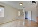 Tile-floored living space with stairs to upper level and adjacent closet at 11833 Amistoso Ln, Las Vegas, NV 89138