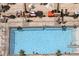 Aerial view of a luxurious pool deck with lounge chairs and cabanas at 135 E Harmon Ave # 3620, Las Vegas, NV 89109