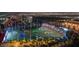 Aerial view of a vibrant golf entertainment complex with illuminated circular targets and spectator areas at 135 E Harmon Ave # 3620, Las Vegas, NV 89109