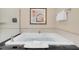 Relaxing bathtub, accompanied by decorative artwork and plush towels, provides a serene bathing experience at 135 E Harmon Ave # 3620, Las Vegas, NV 89109