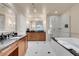 Large, bright bathroom with double vanity, walk-in shower, and soaking tub at 135 E Harmon Ave # 3620, Las Vegas, NV 89109