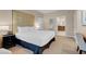 Serene bedroom featuring a plush bed, modern nightstand, and a glimpse into an adjoining bathroom at 135 E Harmon Ave # 3620, Las Vegas, NV 89109
