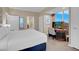 Well-lit bedroom with a work space and partially visible bath at 135 E Harmon Ave # 3620, Las Vegas, NV 89109