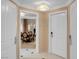 View of a hallway leading into a well-appointed living space, with neutral walls and white doors at 135 E Harmon Ave # 3620, Las Vegas, NV 89109