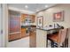 Modern kitchenette featuring stainless steel appliances and a breakfast bar at 135 E Harmon Ave # 3620, Las Vegas, NV 89109